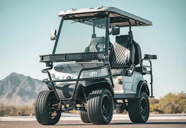 EPIC e40L lifted 4-passenger electric golf cart in white with quilted black seats and front-mounted LED light bar, perfect for Sarasota and off-road cruising